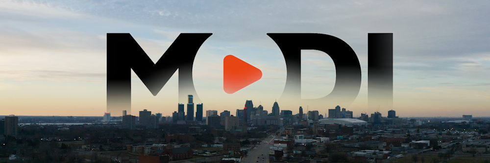 MODI logo on top of Detroit skyline